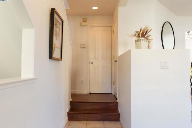 stairs with tile patterned floors