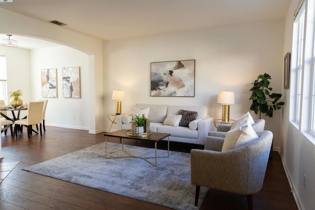 living room with dark hardwood / wood-style floors