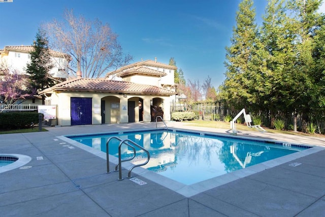 view of pool featuring a patio area