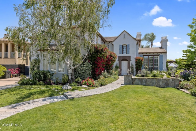 view of front of home with a front yard