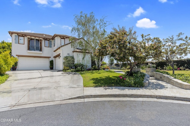 view of front facade with a garage and a front yard