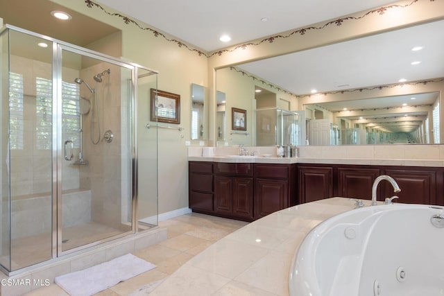 bathroom featuring vanity, independent shower and bath, and tile patterned flooring