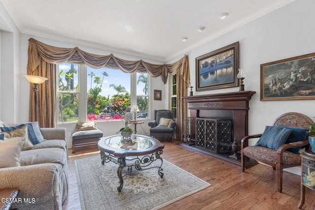 living room with wood-type flooring and crown molding