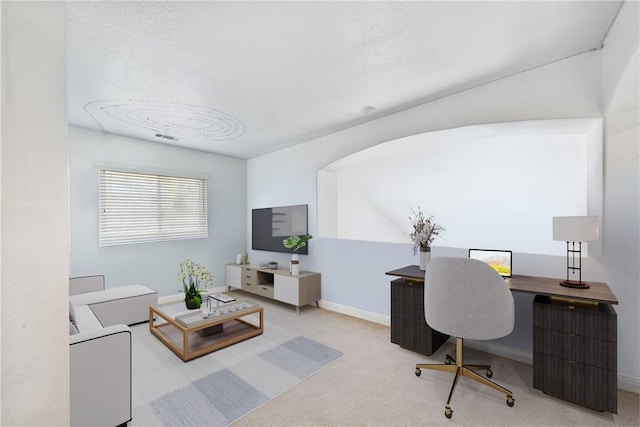 home office with carpet floors and baseboards