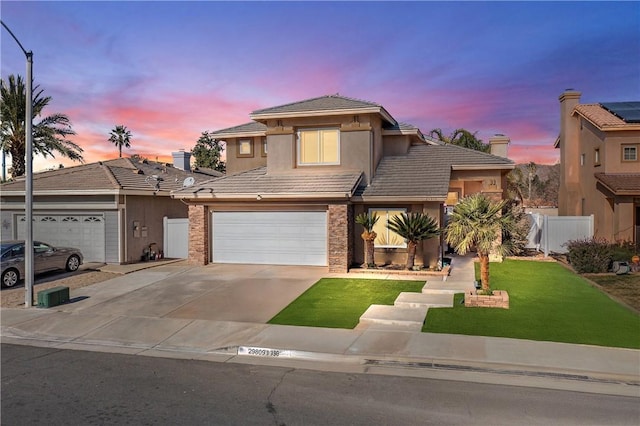 view of front of house featuring a tile roof, fence, driveway, stucco siding, and a front lawn