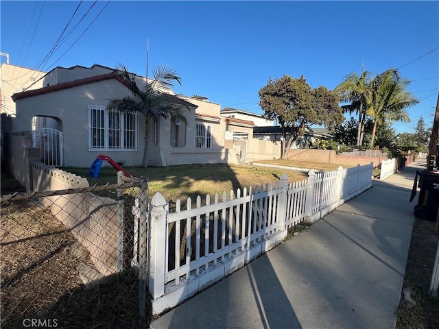 view of side of home featuring a lawn