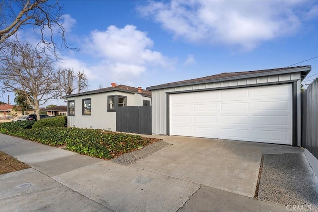 exterior space with a garage and an outdoor structure