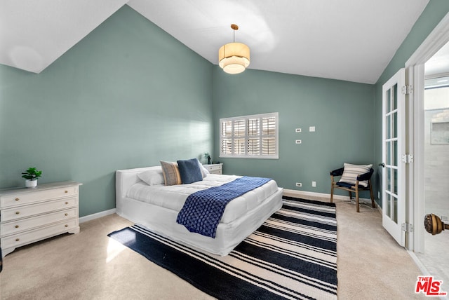 carpeted bedroom featuring vaulted ceiling and multiple windows