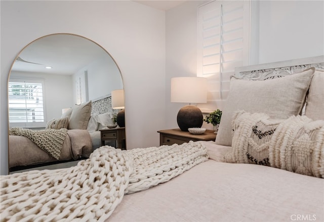 bedroom featuring arched walkways