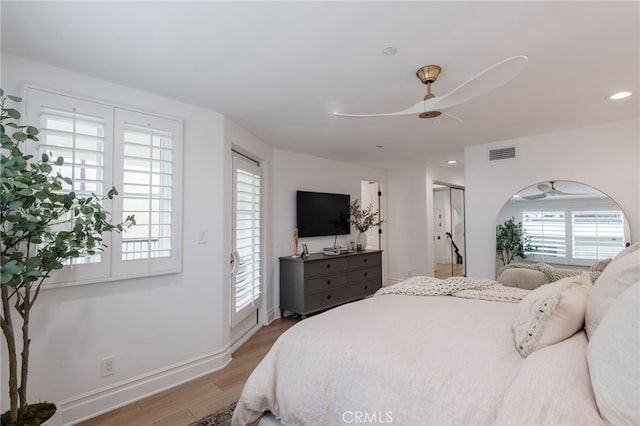 bedroom with light wood finished floors, recessed lighting, visible vents, a ceiling fan, and baseboards