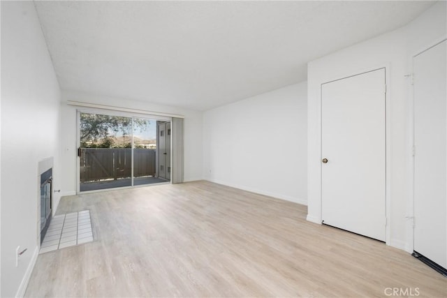 unfurnished living room featuring light wood-type flooring