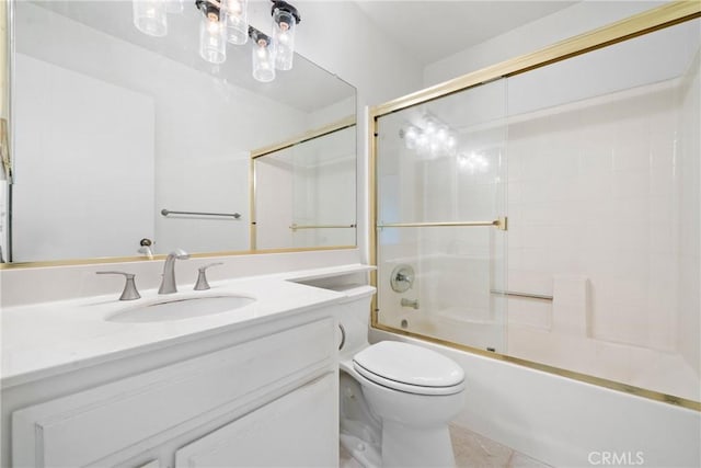 full bathroom with vanity, combined bath / shower with glass door, and toilet