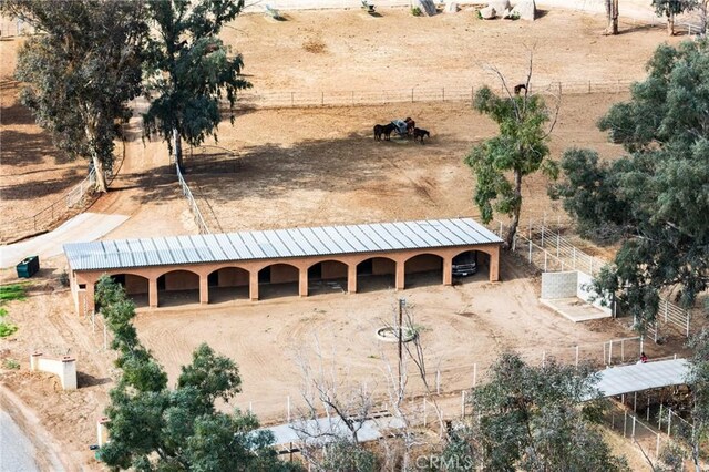 birds eye view of property with a rural view