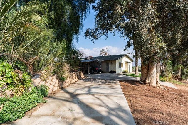 view of front of home with a carport