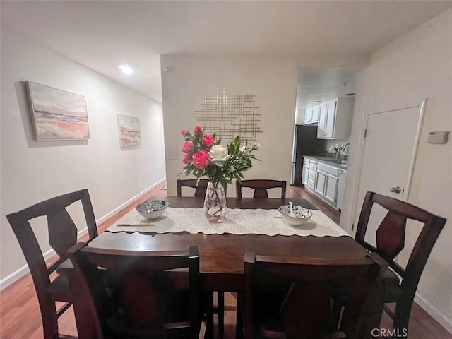 dining area with hardwood / wood-style floors