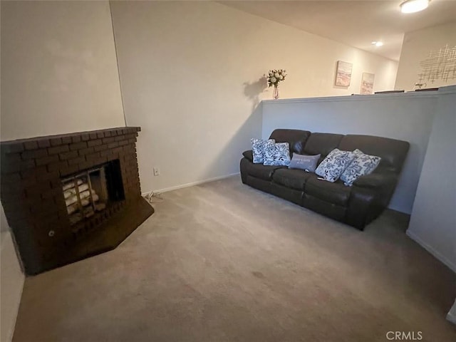 living room featuring carpet and a fireplace