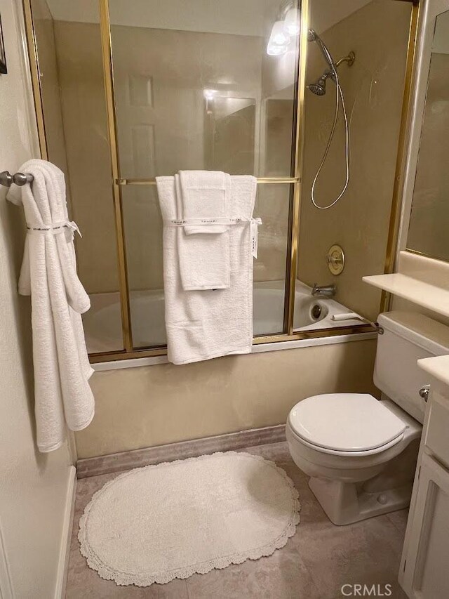 full bathroom with vanity, shower / bath combination with glass door, and toilet