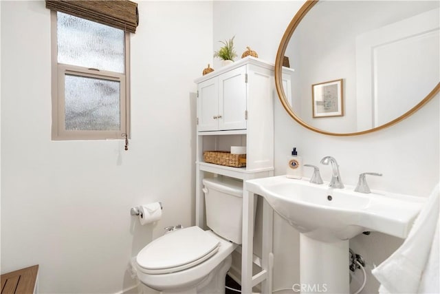 bathroom with sink and toilet