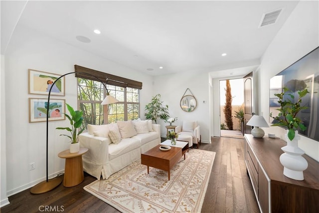 living room with dark hardwood / wood-style flooring