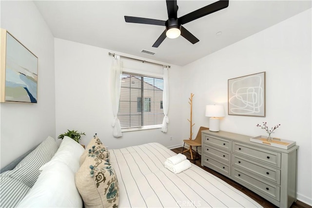 bedroom with dark wood-type flooring and ceiling fan