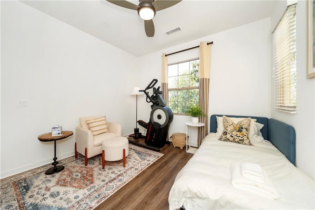 bedroom featuring dark hardwood / wood-style floors and ceiling fan