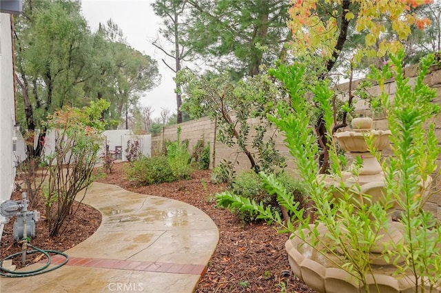 view of yard featuring a patio and a fenced backyard