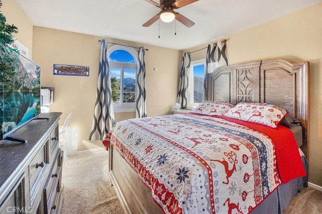 bedroom with ceiling fan and carpet floors