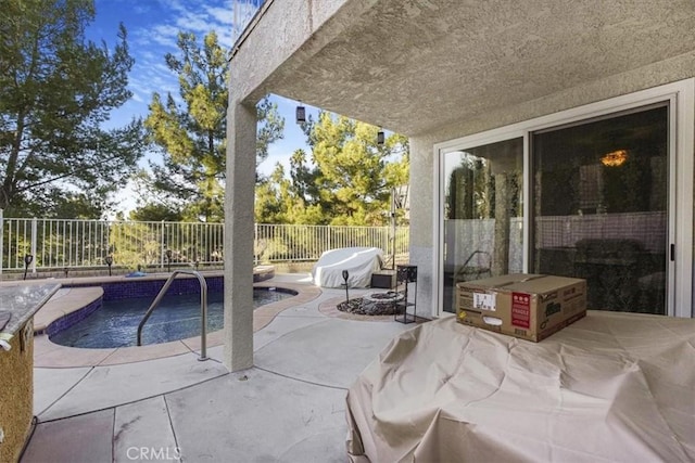 view of pool with an outdoor fire pit and a patio