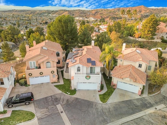 birds eye view of property featuring a mountain view