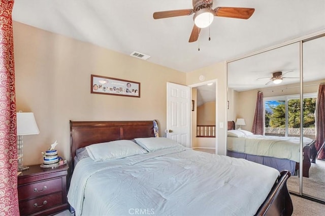 bedroom with carpet, ceiling fan, and a closet