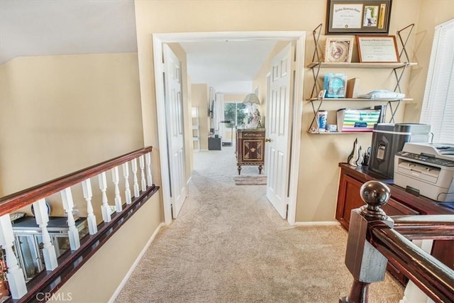 hallway with light carpet