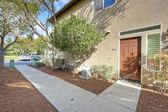 property entrance featuring cooling unit