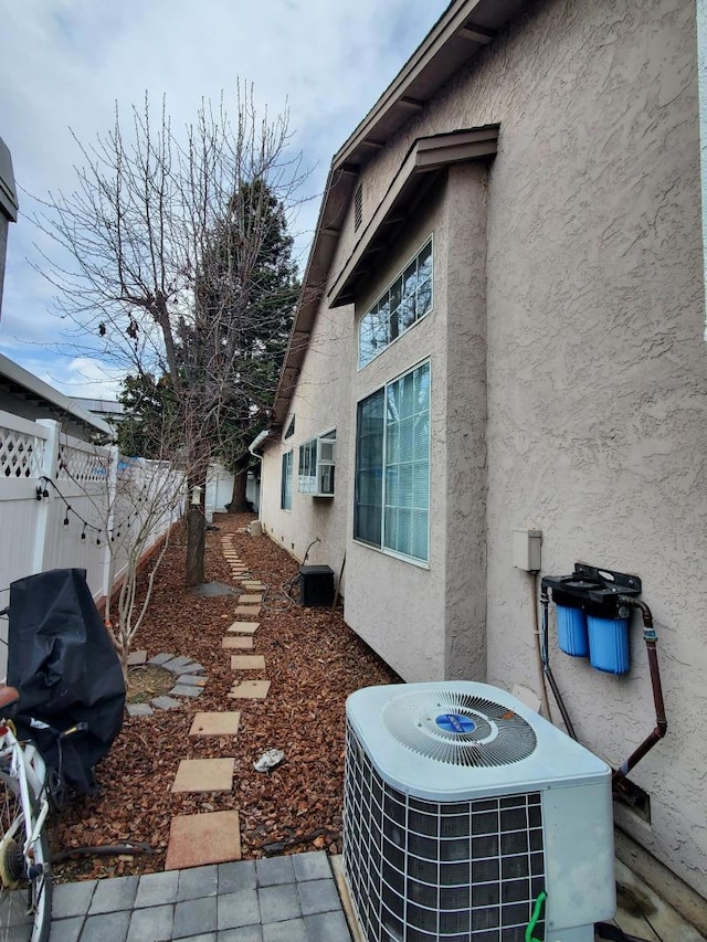 view of home's exterior with cooling unit