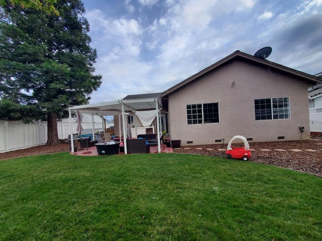 rear view of property featuring a patio, an outdoor living space, a pergola, and a lawn