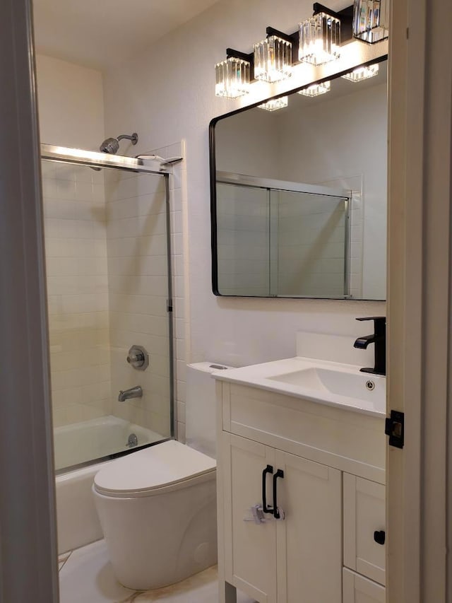 full bathroom with vanity, shower / bath combination with glass door, and toilet