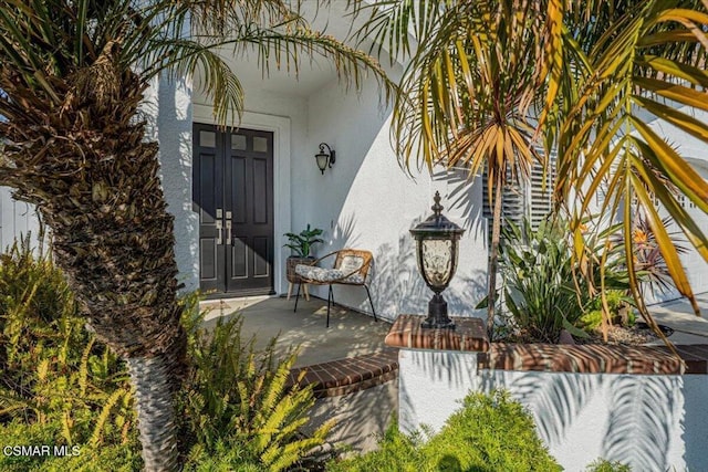 property entrance with a patio