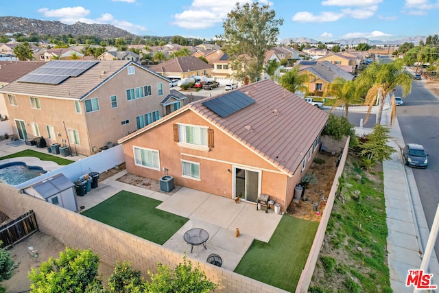 birds eye view of property with a mountain view