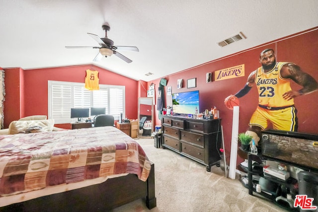 carpeted bedroom with ceiling fan and lofted ceiling