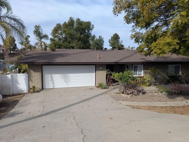 ranch-style home featuring a garage