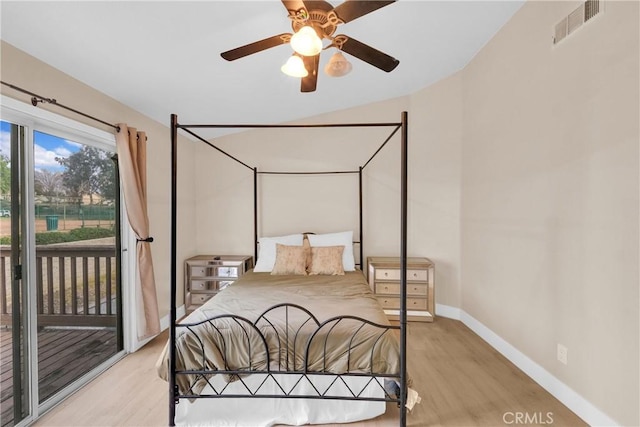 bedroom featuring ceiling fan, light hardwood / wood-style floors, and access to outside