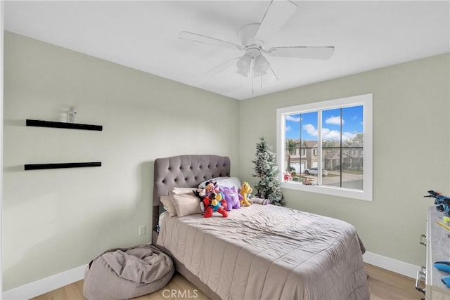 bedroom featuring ceiling fan and light hardwood / wood-style floors