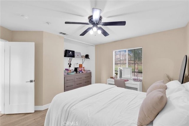 bedroom featuring ceiling fan and light hardwood / wood-style flooring