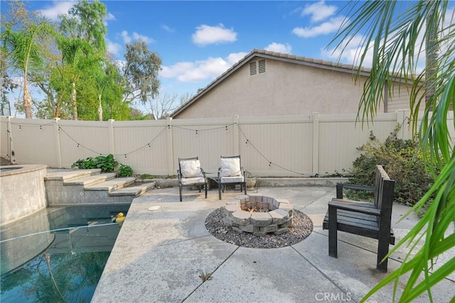 view of patio with an outdoor fire pit