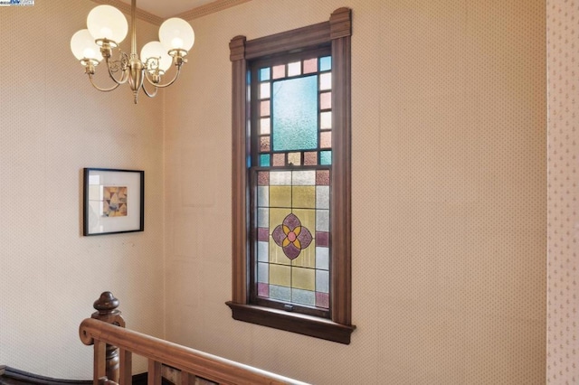 room details featuring an inviting chandelier and ornamental molding