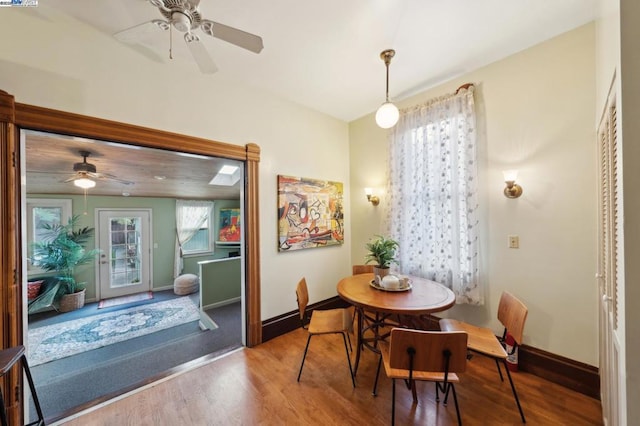 dining area featuring hardwood / wood-style flooring and ceiling fan