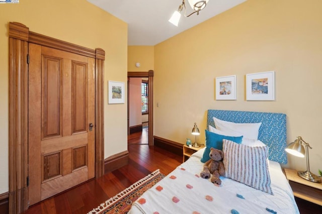 bedroom featuring dark wood-type flooring