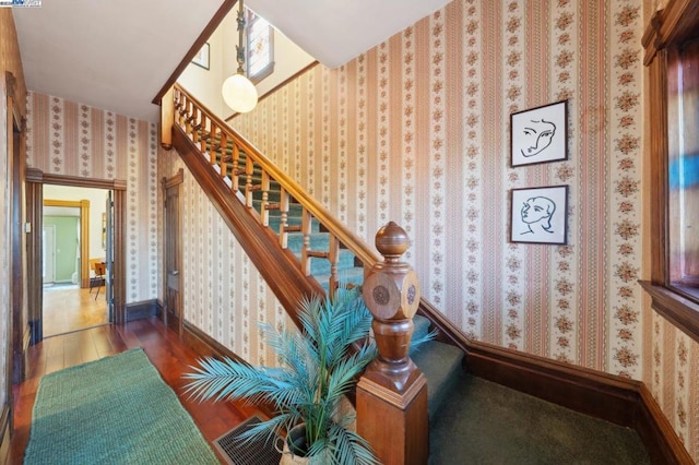 stairway with wood-type flooring