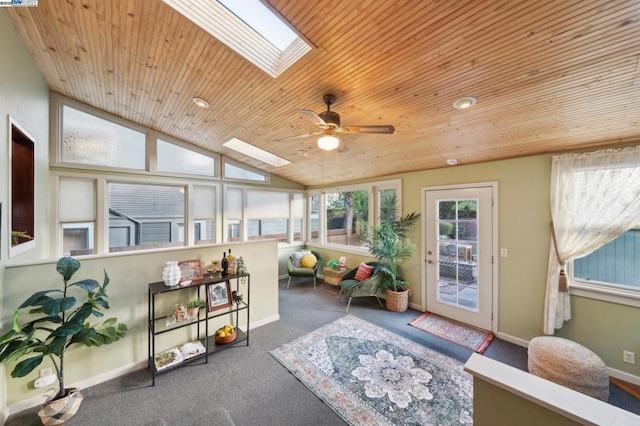 sunroom with wood ceiling, ceiling fan, and vaulted ceiling with skylight