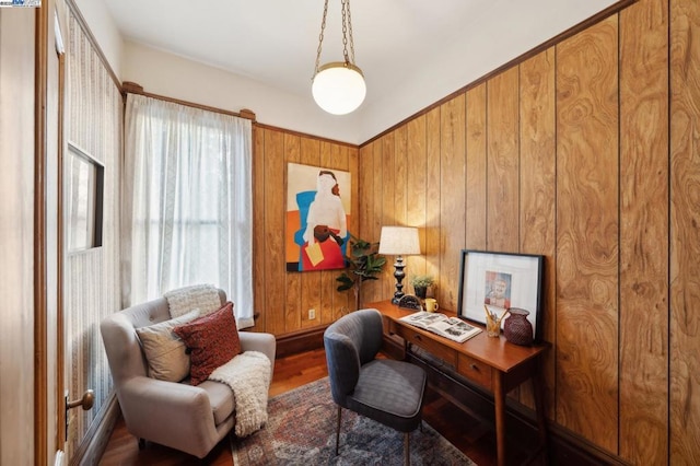 office area featuring wood-type flooring and wooden walls