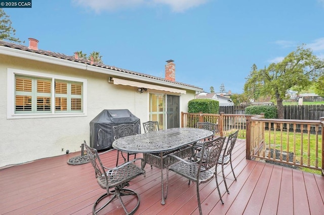 wooden terrace with grilling area